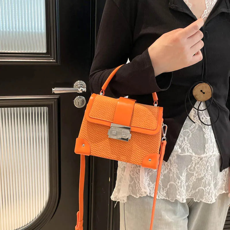 PU leather crossbody bag in horizontal square shape with sewing thread detail, available in seven colours
