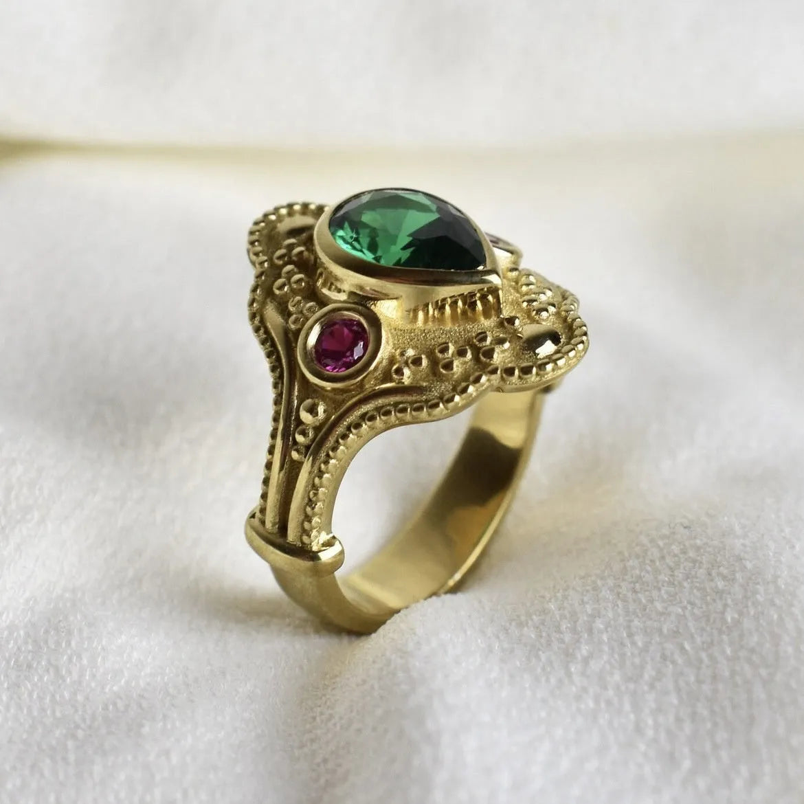 Women's golden Lvzuan geometric ring electroplated on alloy, shown on a hand
