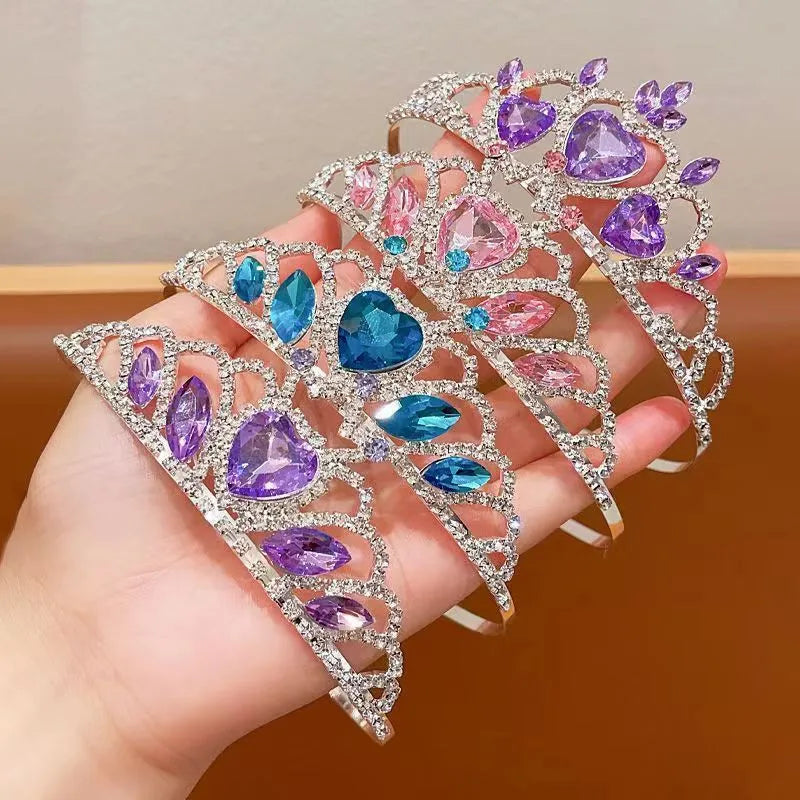 Girl's shiny metal headband with a crystal crown design in pink, light blue, and light purple colours.