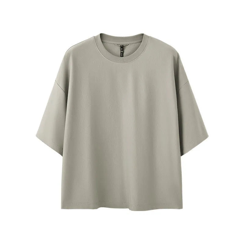 A sand grey men's loose fit short sleeve pullover made from a cotton and polyester blend fabric.