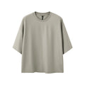 A sand grey men's loose fit short sleeve pullover made from a cotton and polyester blend fabric.