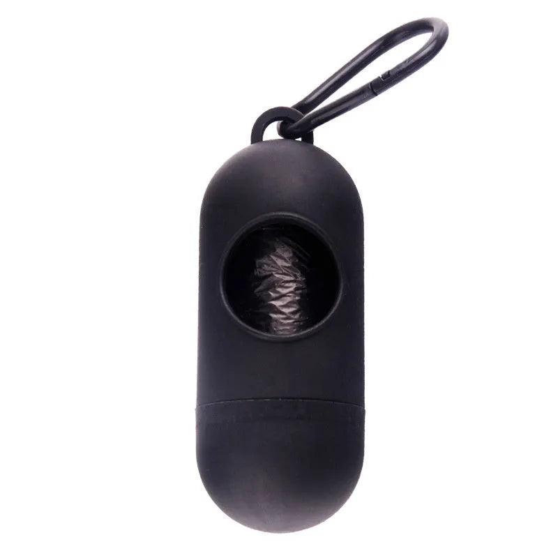 Black plastic dog poop bag dispenser with Velcro strap and a side metal hook.