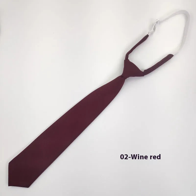 A navy blue cotton men's bow tie with an arrow style design on a white background.