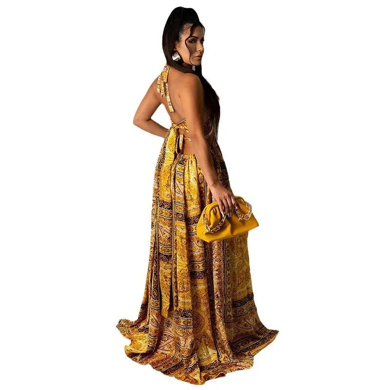 Sleeveless printed halter split dress in yellow brown with mid waist and long skirt, sizes S to 3XL.