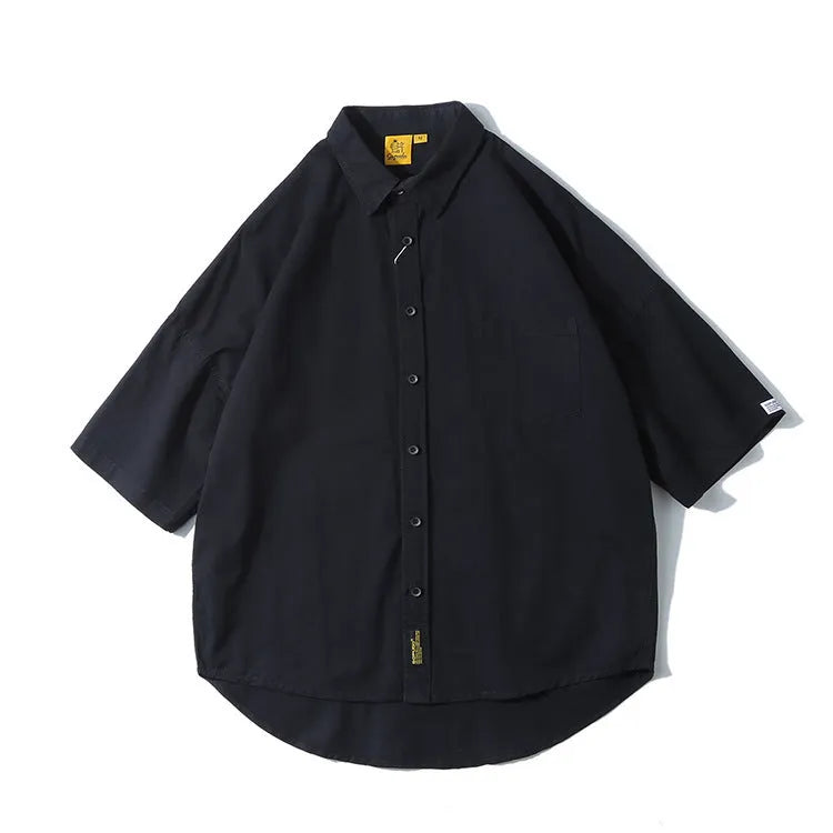 Man wearing a loose-fit Japanese style cotton cardigan shirt in a summer colour.
