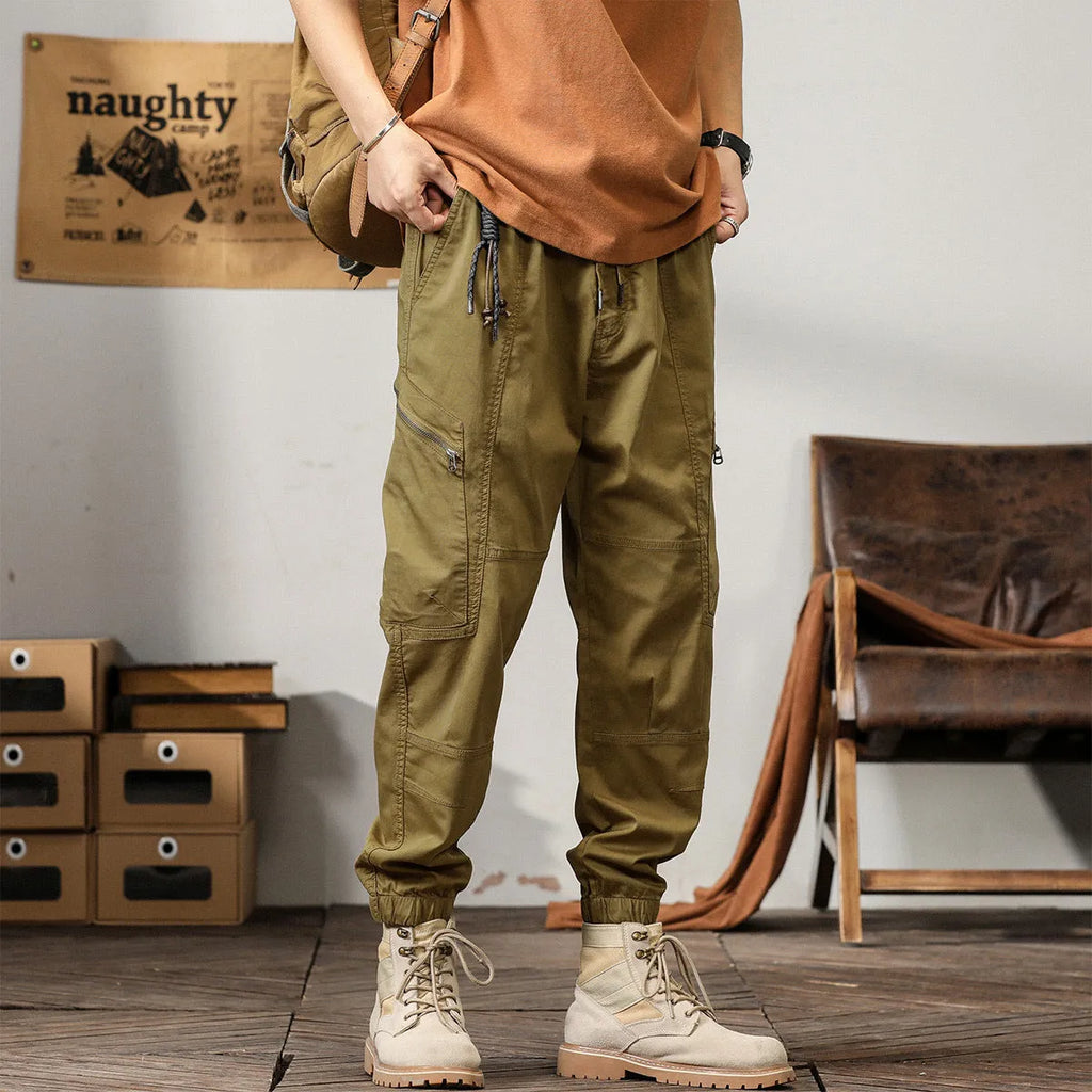 Men's tapered harem trousers in cotton with ankle band and zip placket front