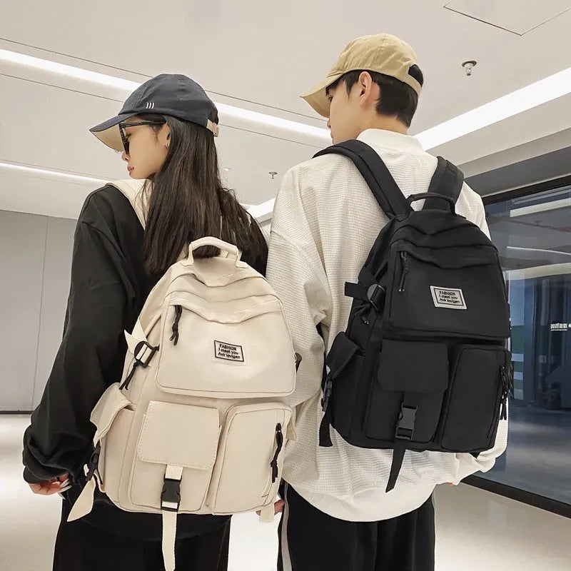 Soft nylon student backpack in black with three-dimensional pockets and laptop compartment