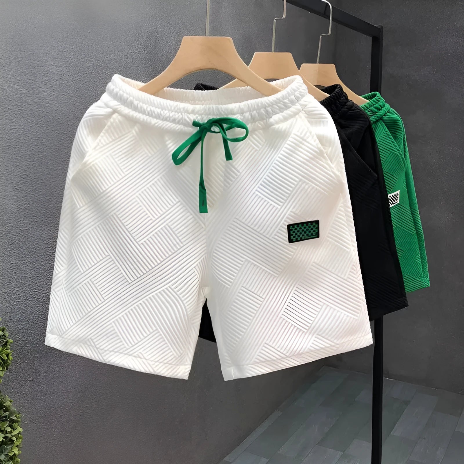 Men's solid colour casual sports shorts with micro elasticity in white, black, or green options