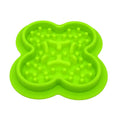 Blue silicone pet licking pad slow feeder mat on a floor.