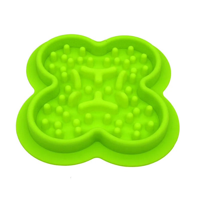 Blue silicone pet licking pad slow feeder mat on a floor.