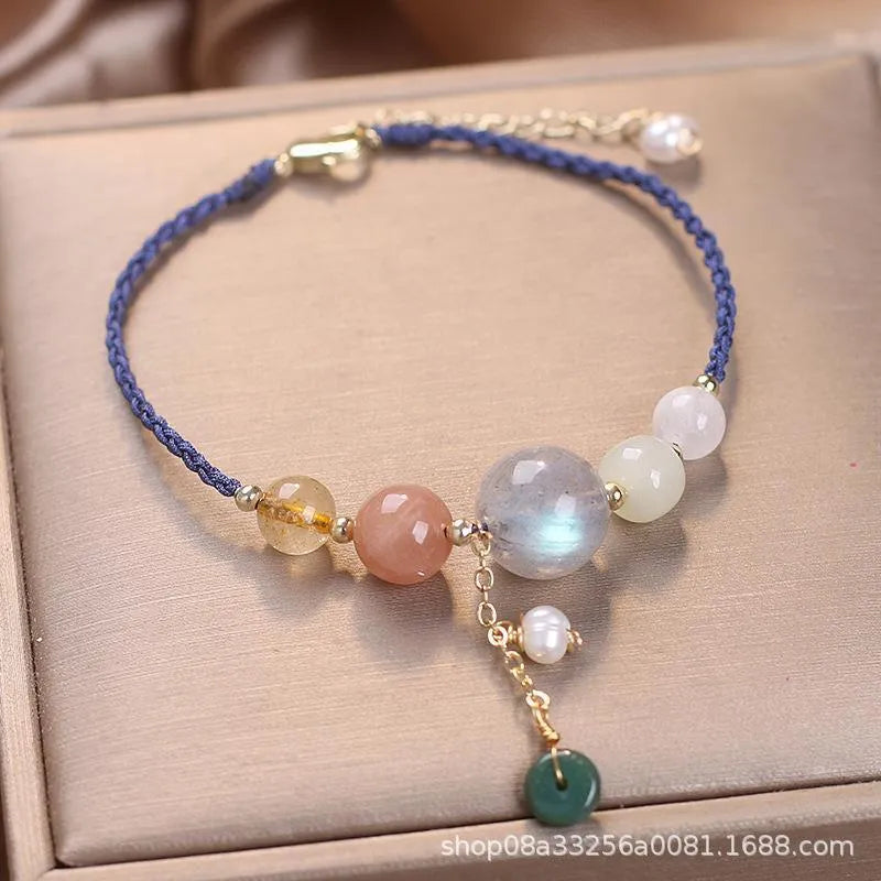 Hand-woven women's crystal bracelet with peace buckle clasp and sequin accents