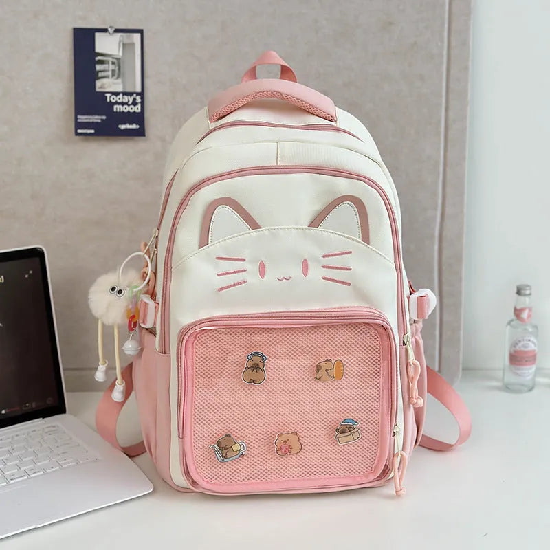 Korean cartoon backpack in multiple colours with curved shoulder straps and badge pendant options