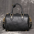Brown yellow cowhide leather Boston bag with single shoulder strap, showing cylindrical shape and open outer pocket.