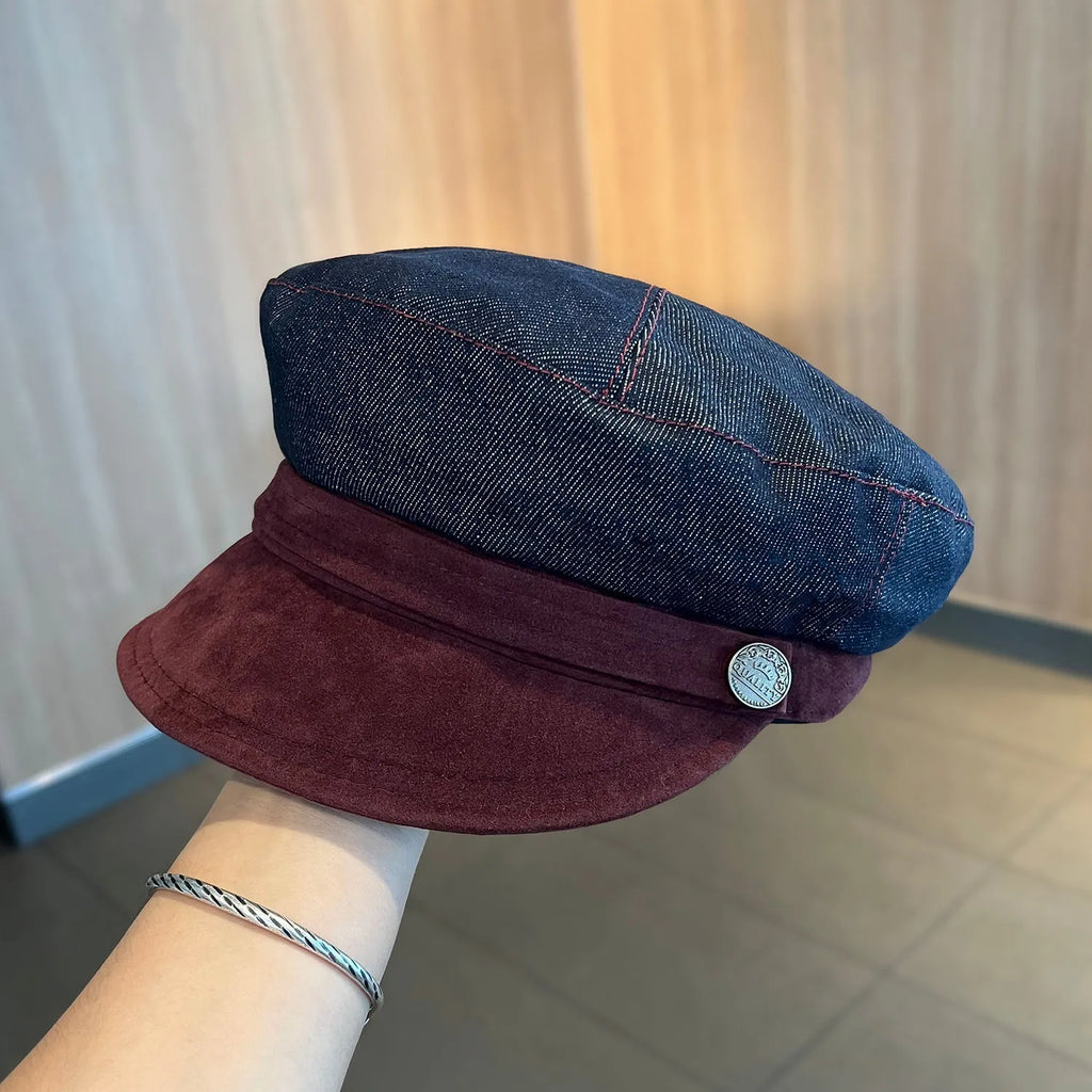 Dark blue denim newsboy hat with octagonal retro design and adjustable sizing