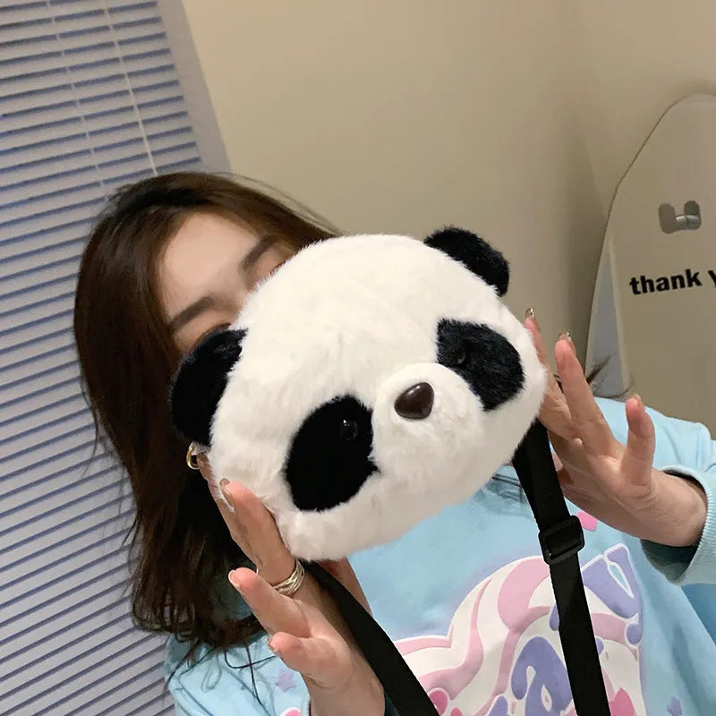 Soft plush cylindrical crossbody bag in Panda Head colour, showing dimensions and sandwich pocket.