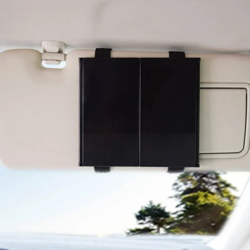 Silver folding car makeup mirror shown closed and opened, highlighting its compact and large glass sizes.