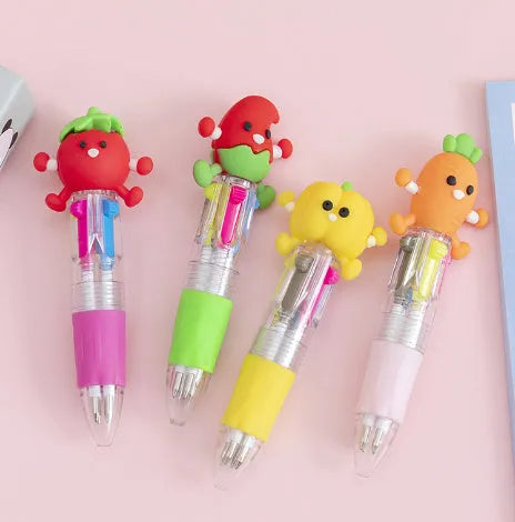 A press-action ballpoint pen with a four-colour cartridge, showing one of five random cartoon designs on the barrel.