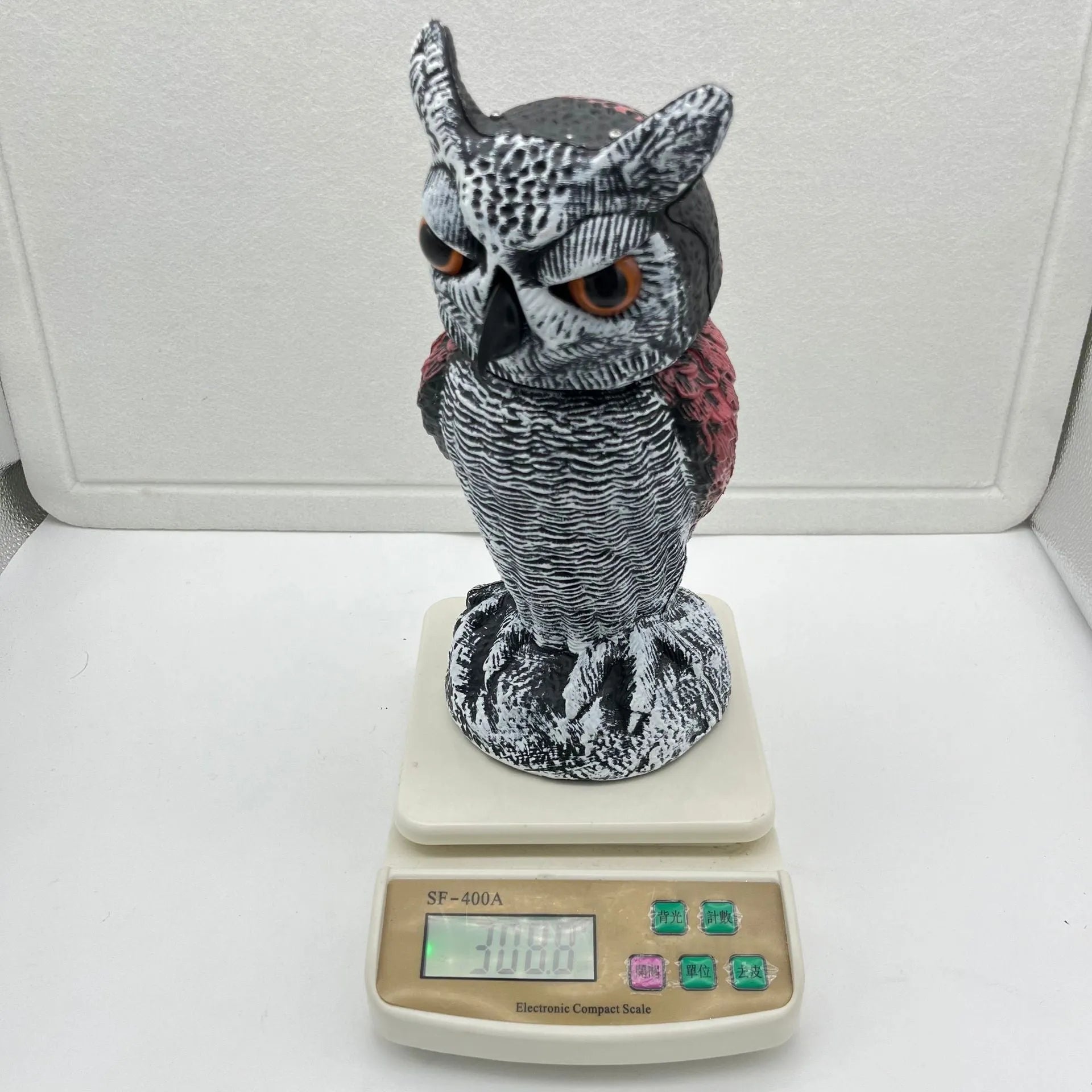 PE plastic artificial owl decoy with moving head, a bird scare ornament for outdoor use.