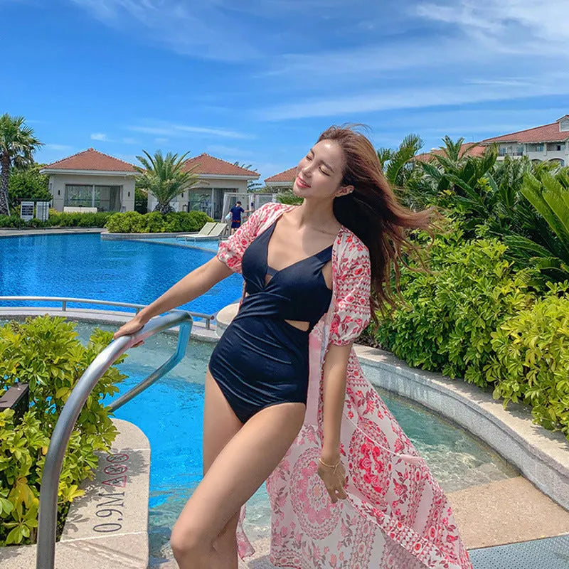 Women's dark blue one-piece swimsuit with hollow cut-out design and siamese styling