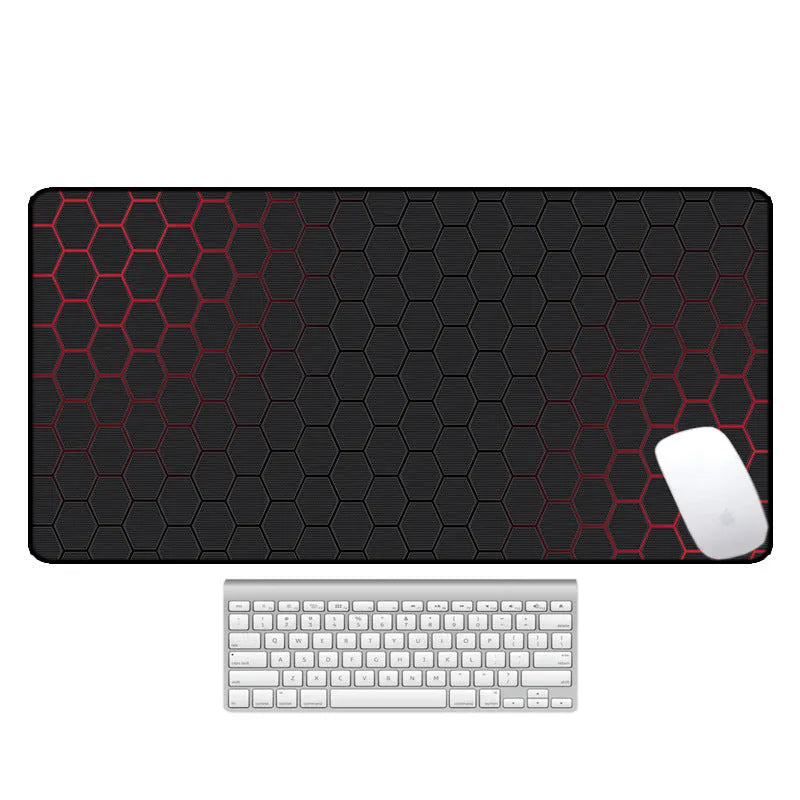 Large printed desk mouse pad with natural rubber non-slip base, shown on a wooden desk.