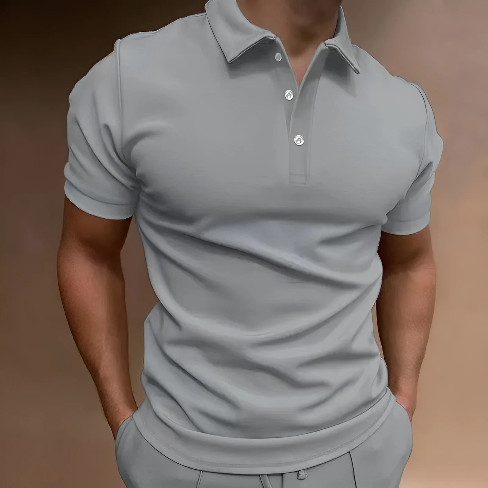 Man modelling a loose fit grey cotton blend short sleeve t-shirt.