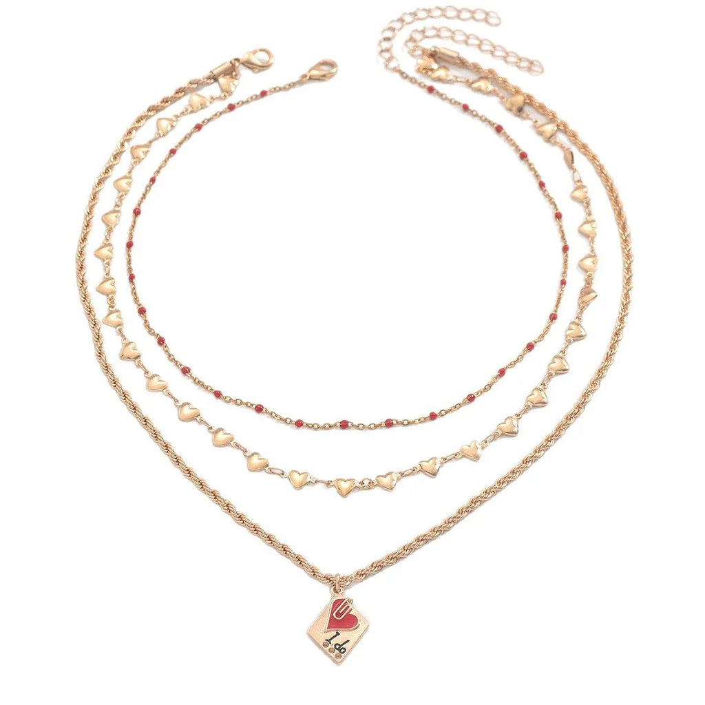 Close-up of a zinc alloy heart pendant on an adjustable three-layer clavicle chain necklace.