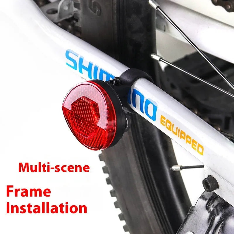 Red plastic bicycle seat post bracket for mounting a rear anti-theft taillight.