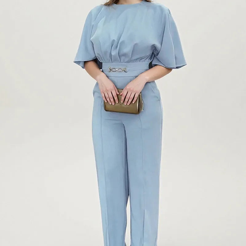 Blue men's casual suit with long sleeves and trousers on a hanger