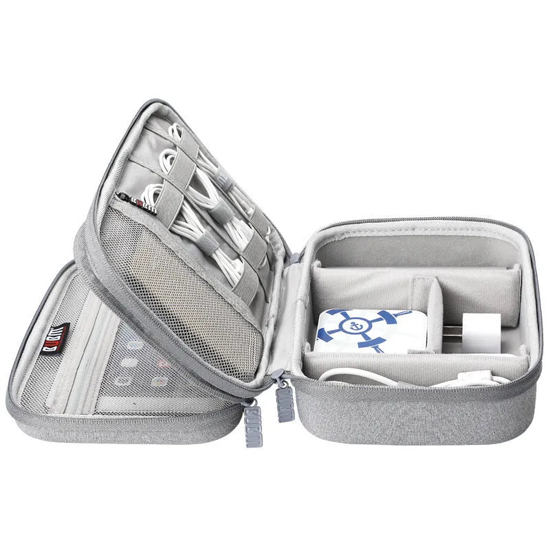 Black EVA digital storage bag for organising headphones and cables on a desk