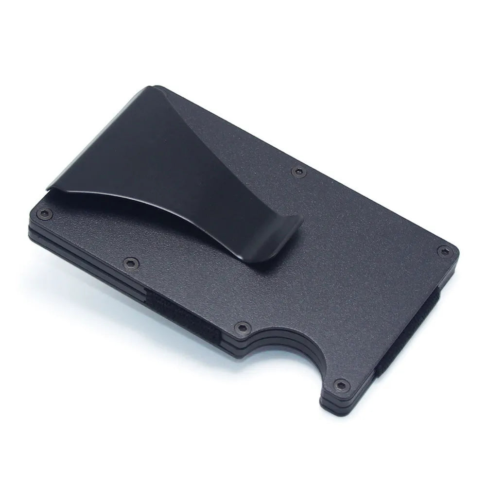 Slim black carbon fibre geometric wallet holding bank cards, showing 8mm thickness profile.
