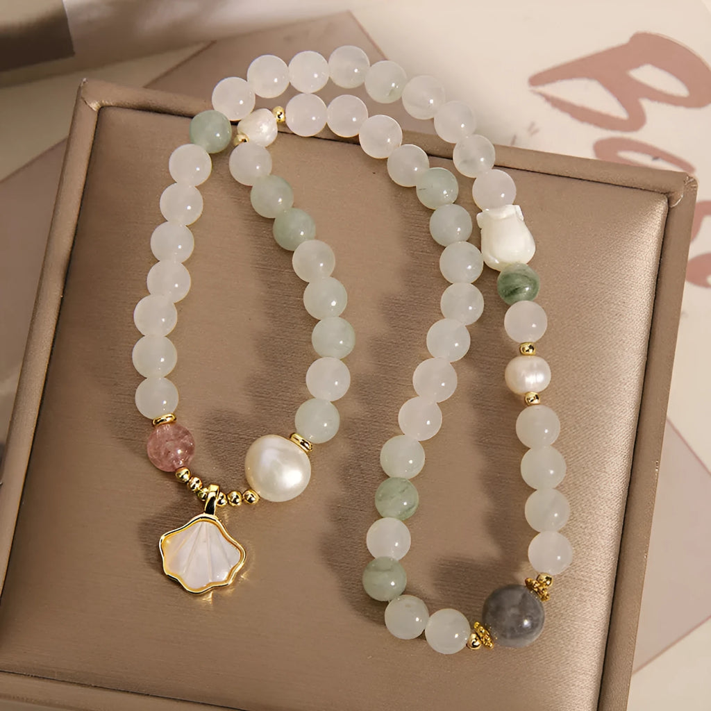 Women's Tianshan emerald green crystal bracelet with gold-plated apricot leaf pendant and rhinestones.