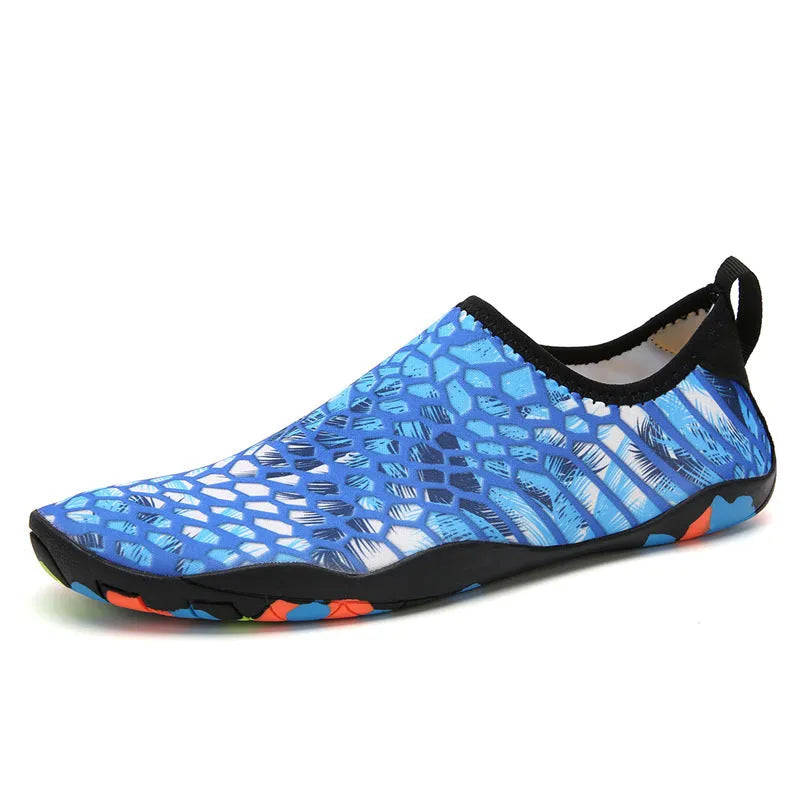 Blue Lycra beach wading shoes with EVA sole for men and women, shown on a sandy background.