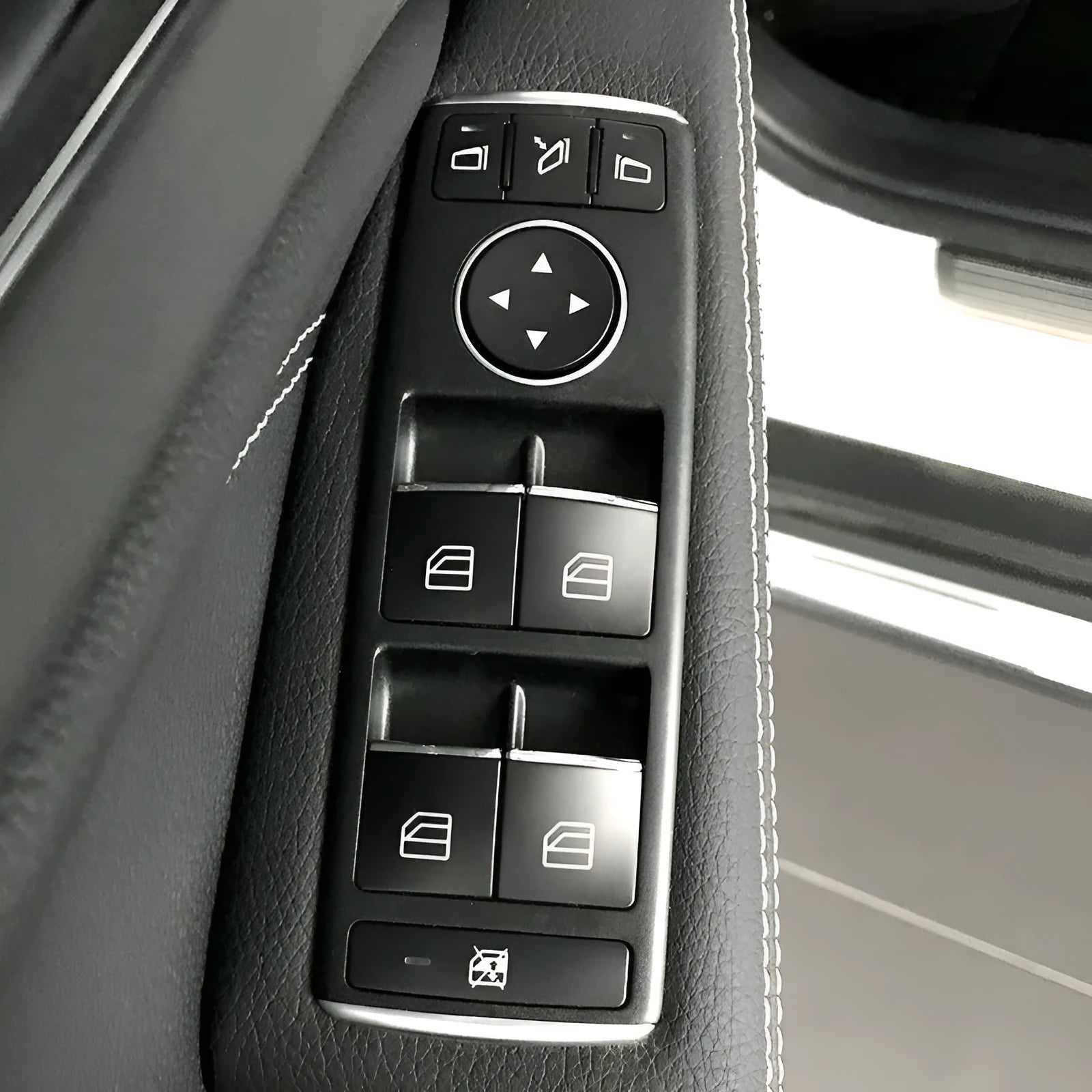 Black ABS plastic decorative sticker for a car window lift button.