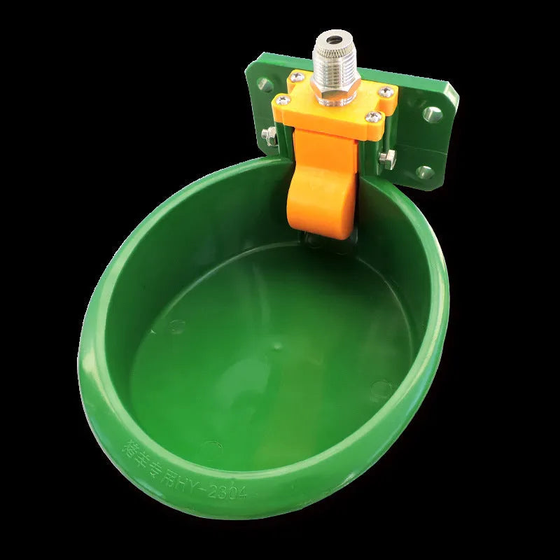 Green plastic automatic drinking bowl for sheep and pigs on farms