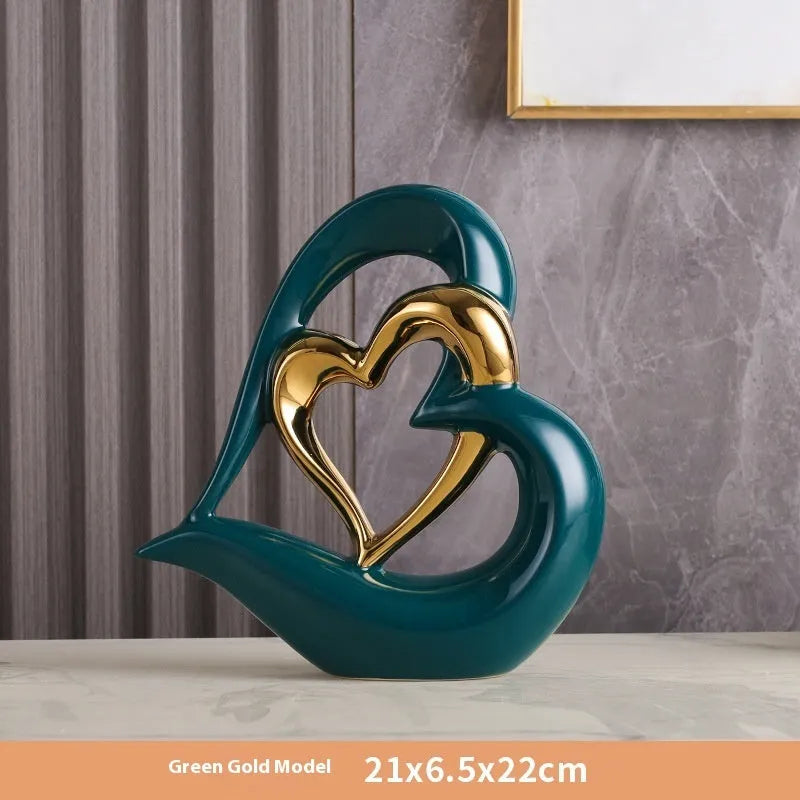 Modern geometric heart ornament in metallic finish displayed on shelf