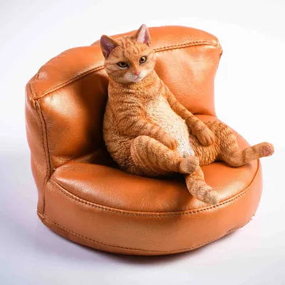 Lazy cat car ornament figure on fabric sofa, 7.5cm high resin model decoration.