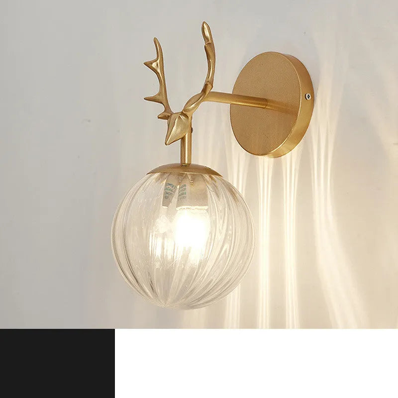 Modern round glass wall sconce with a Nordic design, mounted on a white wall, showing its light-diffusing shade and compact 30cm diameter.