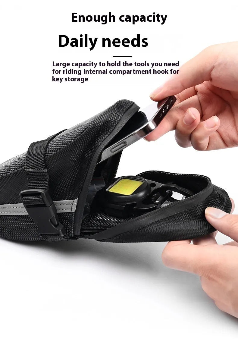 Black quick release bicycle saddle bag mounted under bike seat with tool capacity dimensions 20x8x6cm