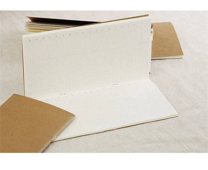 Diary refill inner core showing saddle stitch binding and 11x21cm dimensions