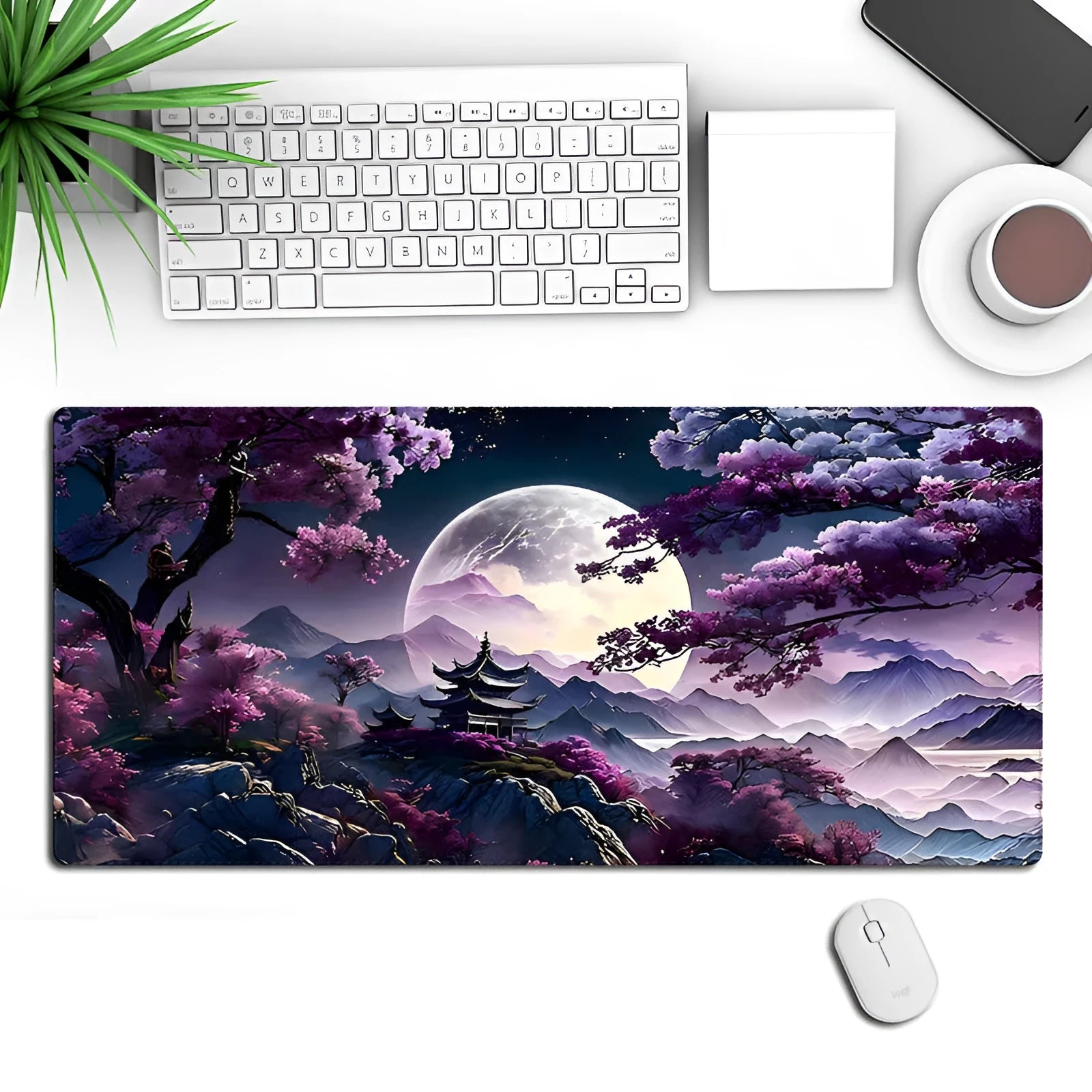 Large black gaming desk mat with pattern, shown on a desk with keyboard and mouse.