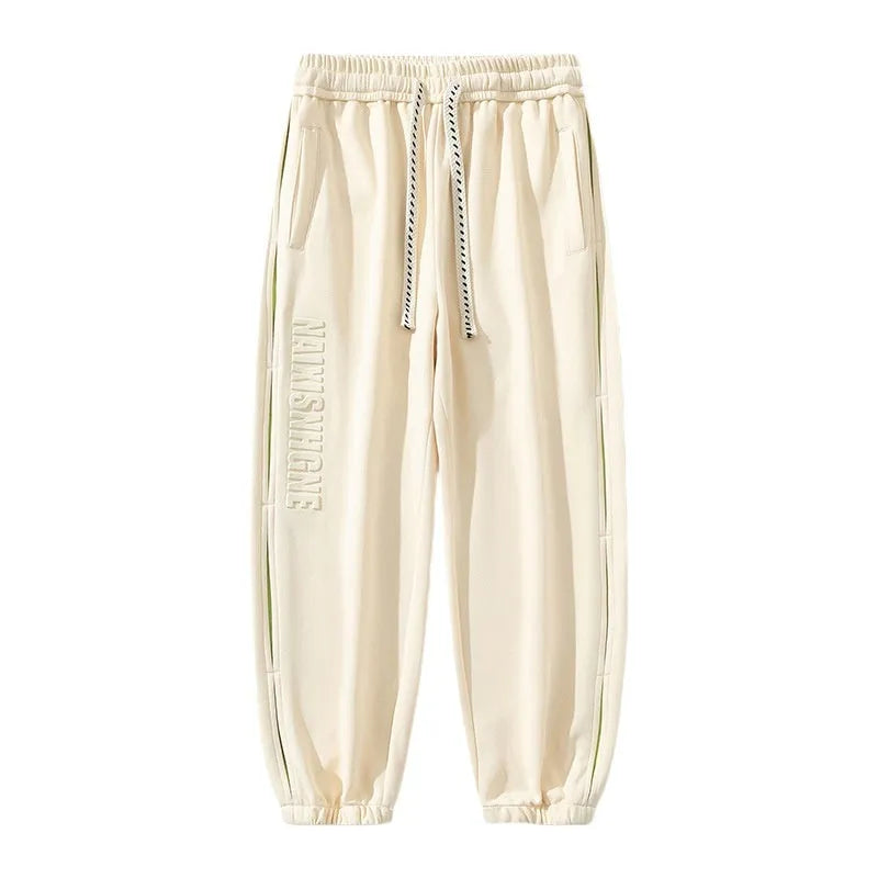 Men's loose cotton trousers with stitching detailing and ankle banding in grey green colour