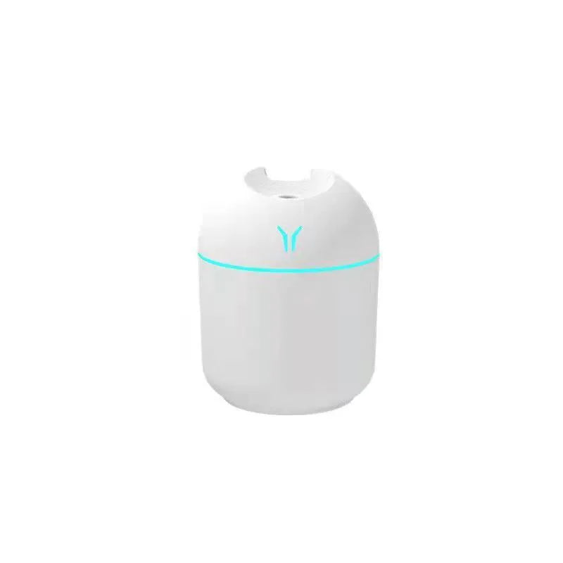 Compact round desktop humidifier with USB cable in ivory white, sky blue, or pink.