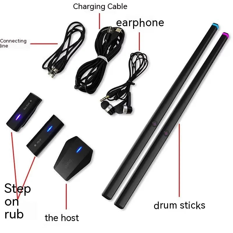 Black somatosensory air drum kit with wireless host unit, two drumsticks, and charging accessories on dark background