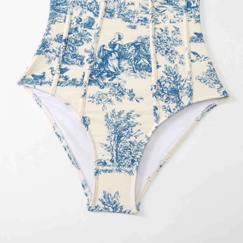Blue women's one-piece swimsuit with matching gauze skirt set on hanger