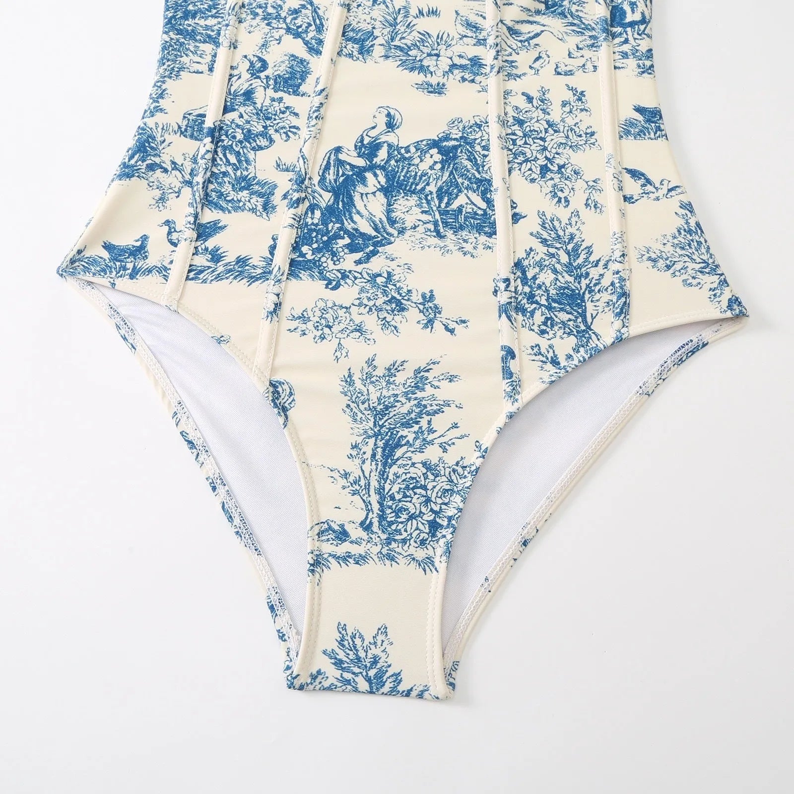 Blue women's one-piece swimsuit with matching gauze skirt set on hanger