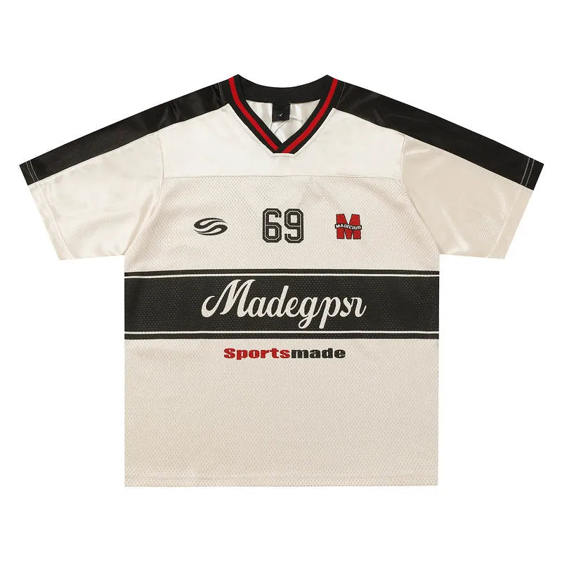 Apricot coloured loose fit V-neck sports jersey with short sleeves and a printed letter pattern.