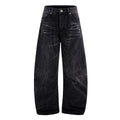 Men's black American washed straight leg jeans with old lightning crack detailing on a plain background