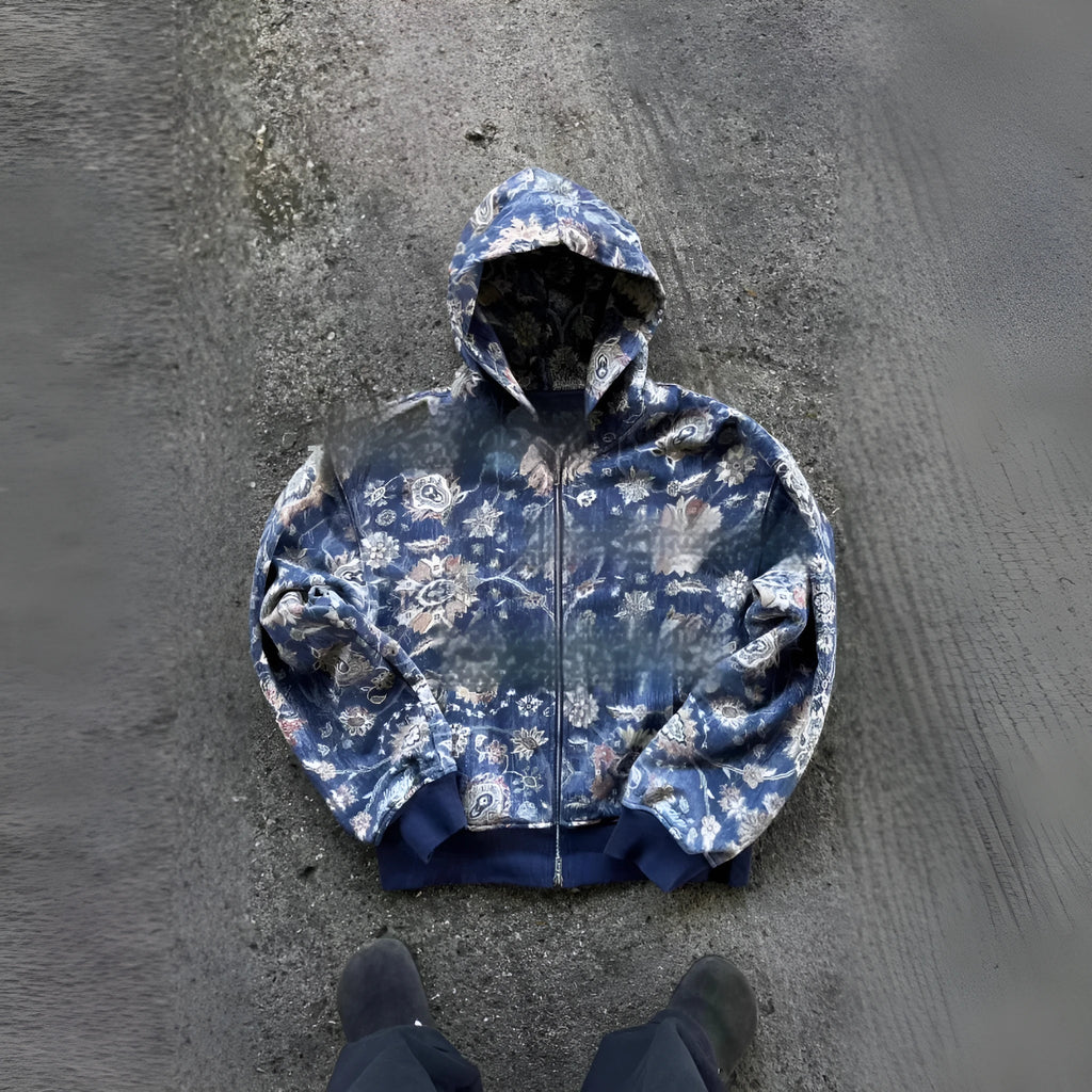 Men's loose blue hooded zip coat with long sleeves on a hanger