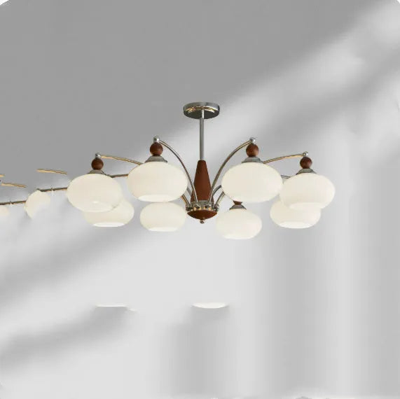 Persimmon glass and chrome chandelier with multiple glass lampshades in a choice of colours.