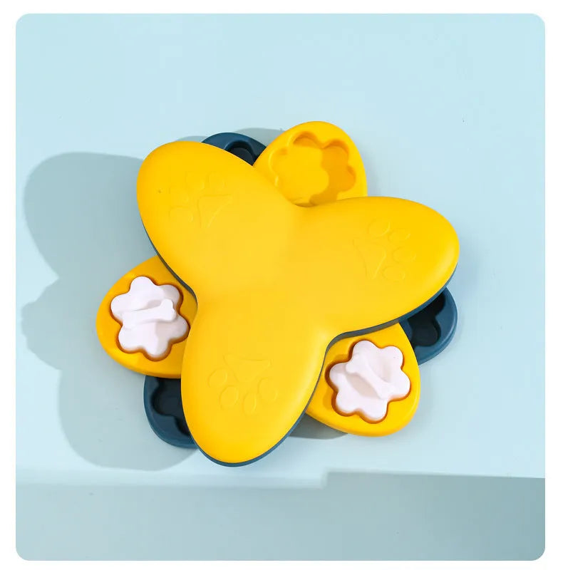Green and yellow interactive dog puzzle toy slow feeder bowl with nine bone-covered compartments.